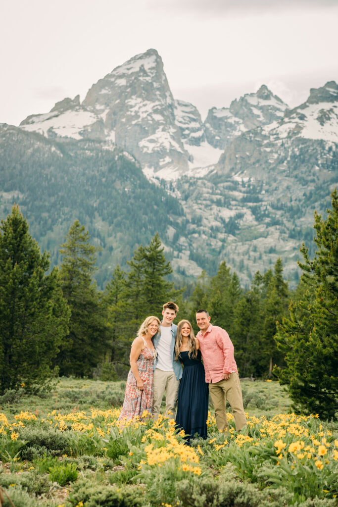 Sunset family photos with the Teton mountains in Grand Teton National Park in June with the sunflowers