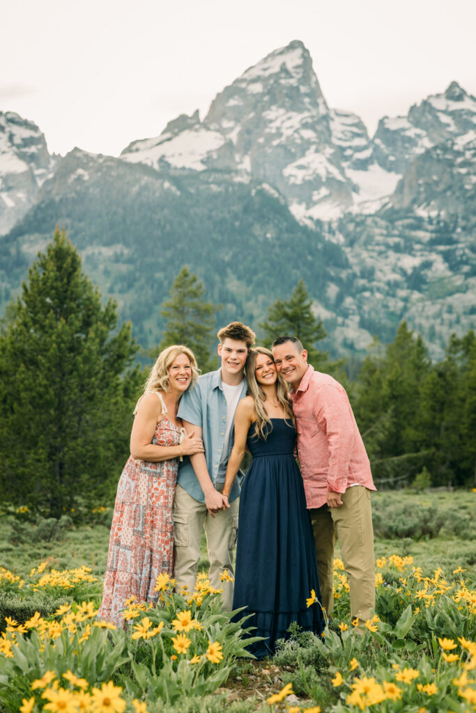 Sunset family photos with the Teton mountains in Grand Teton National Park in June with the sunflowers