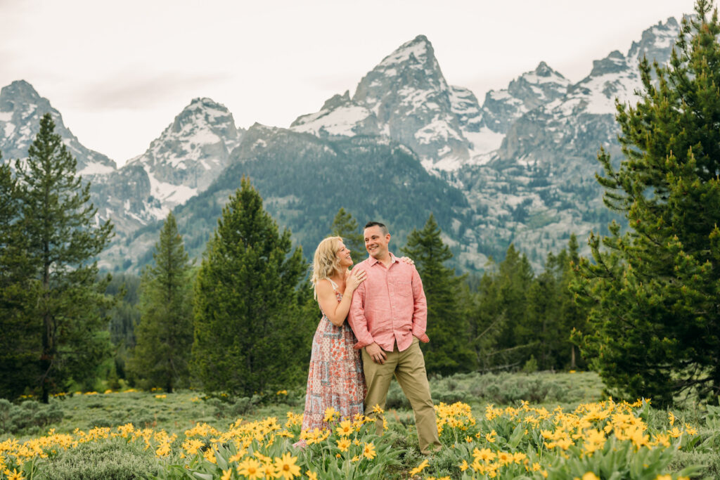 Sunset family photos with the Teton mountains in Grand Teton National Park in June with the sunflowers