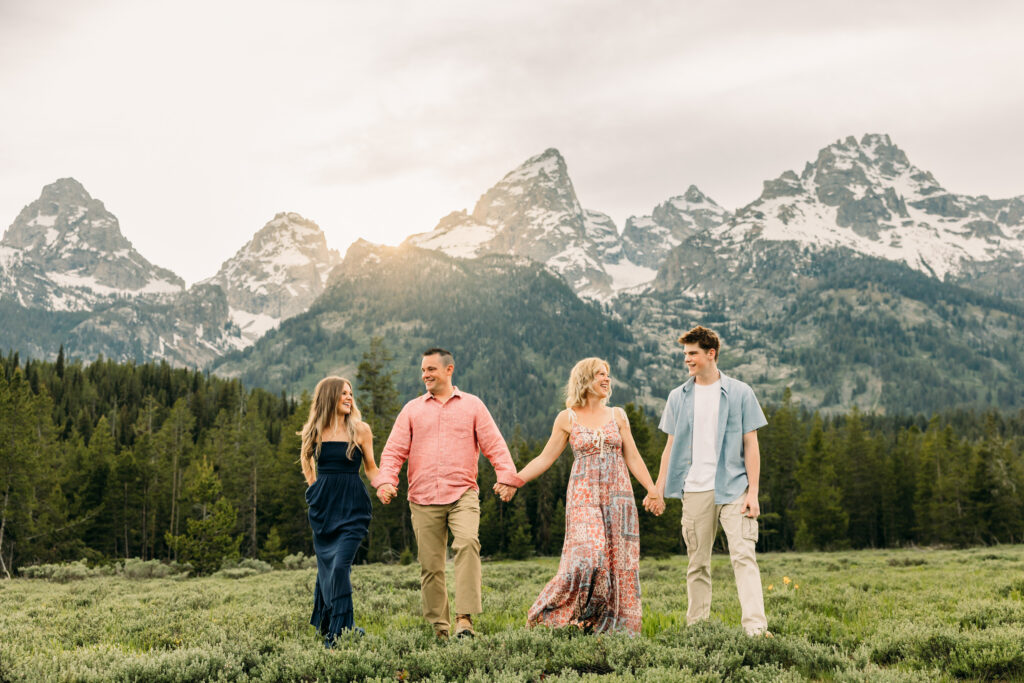 Sunset family photos with the Teton mountains in Grand Teton National Park in June with the sunflowers