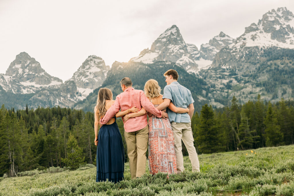 Sunset family photos with the Teton mountains in Grand Teton National Park in June with the sunflowers