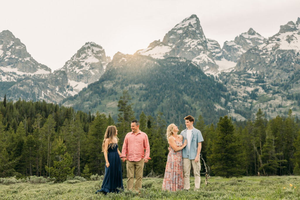 Sunset family photos with the Teton mountains in Grand Teton National Park in June with the sunflowers