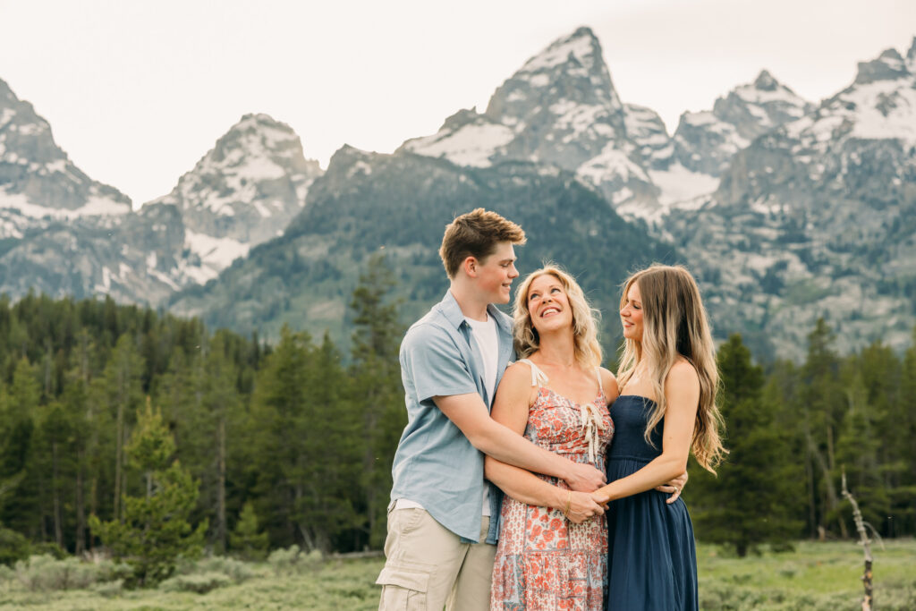 Sunset family photos with the Teton mountains in Grand Teton National Park in June with the sunflowers