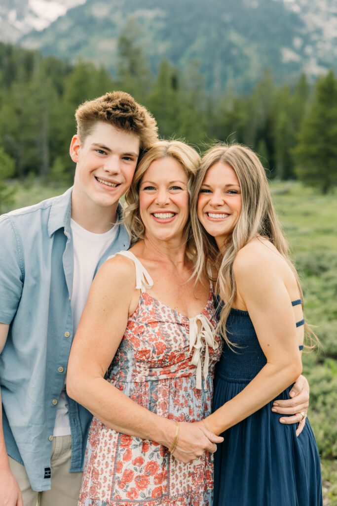 Sunset family photos with the Teton mountains in Grand Teton National Park in June with the sunflowers