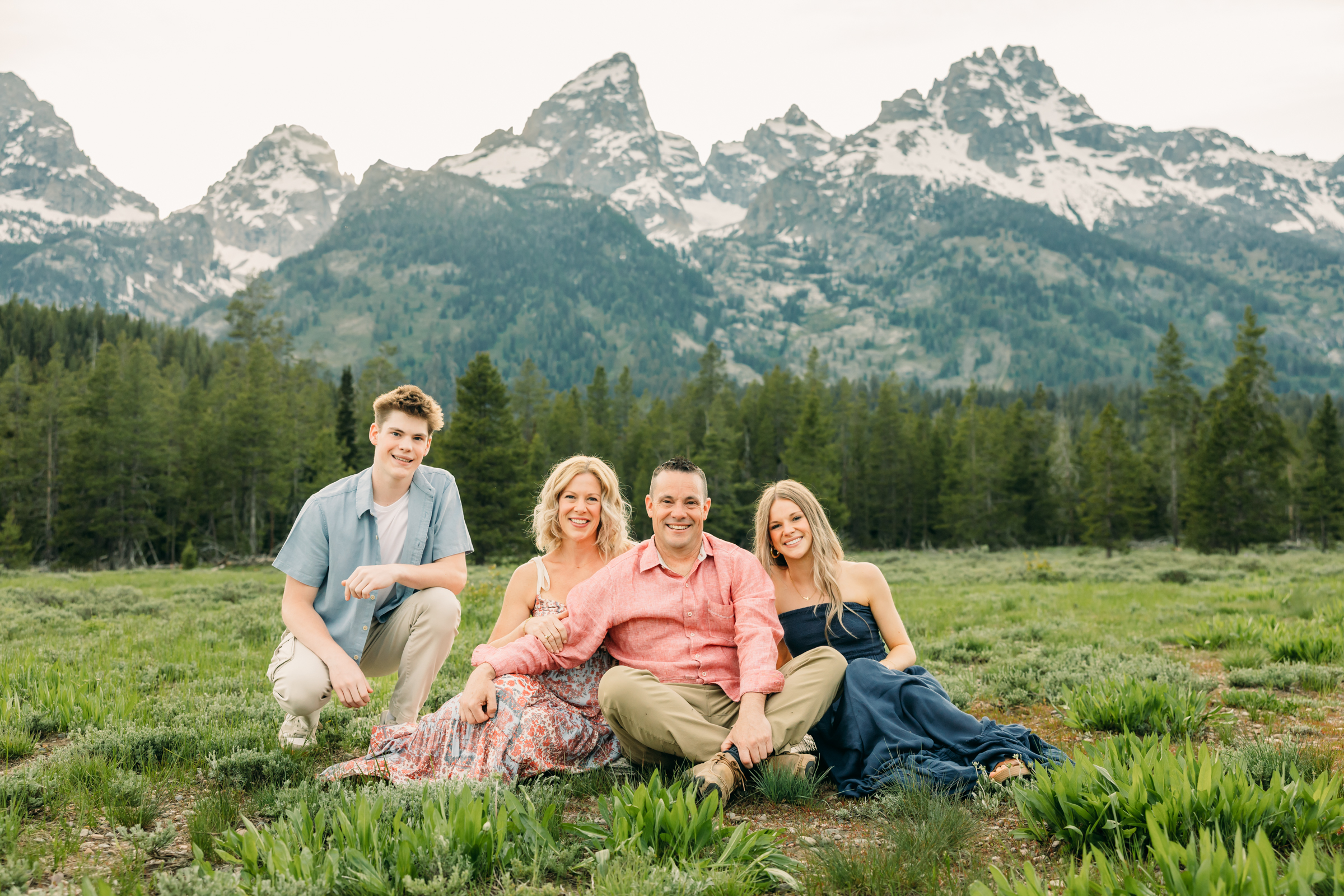 Sunset family photos with the Teton mountains in Grand Teton National Park in June with the sunflowers