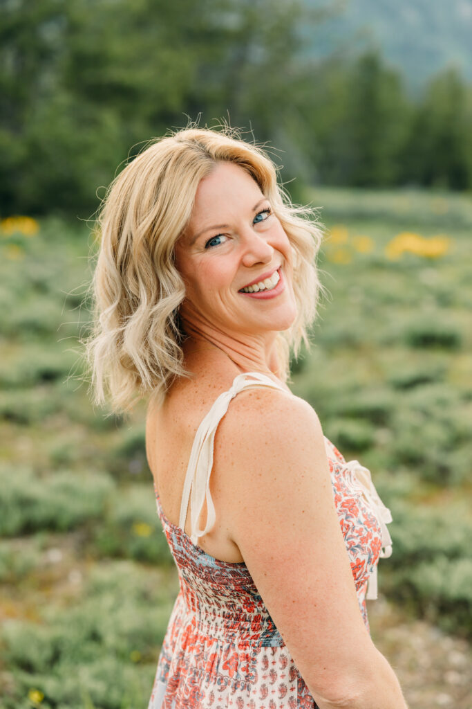 Sunset family photos with the Teton mountains in Grand Teton National Park in June with the sunflowers