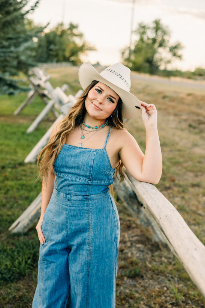 Rustic western senior photos with the Tetons in Wyoming