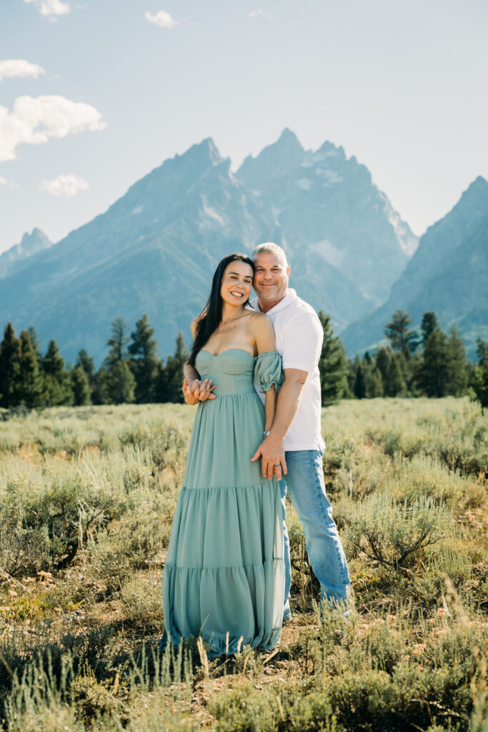 Afternoon photo session in Grand Teton park with Jackson Hole Photographer Kendra Sue Photography mom and dad smiling at camera