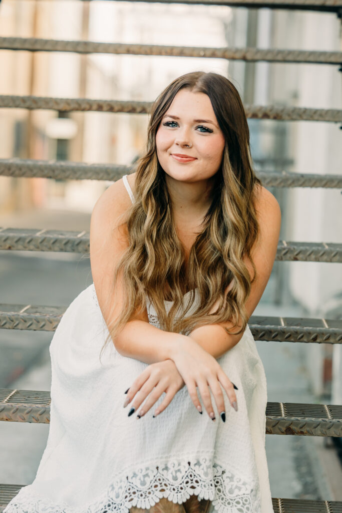 Rustic western senior photos with the Tetons in Wyoming