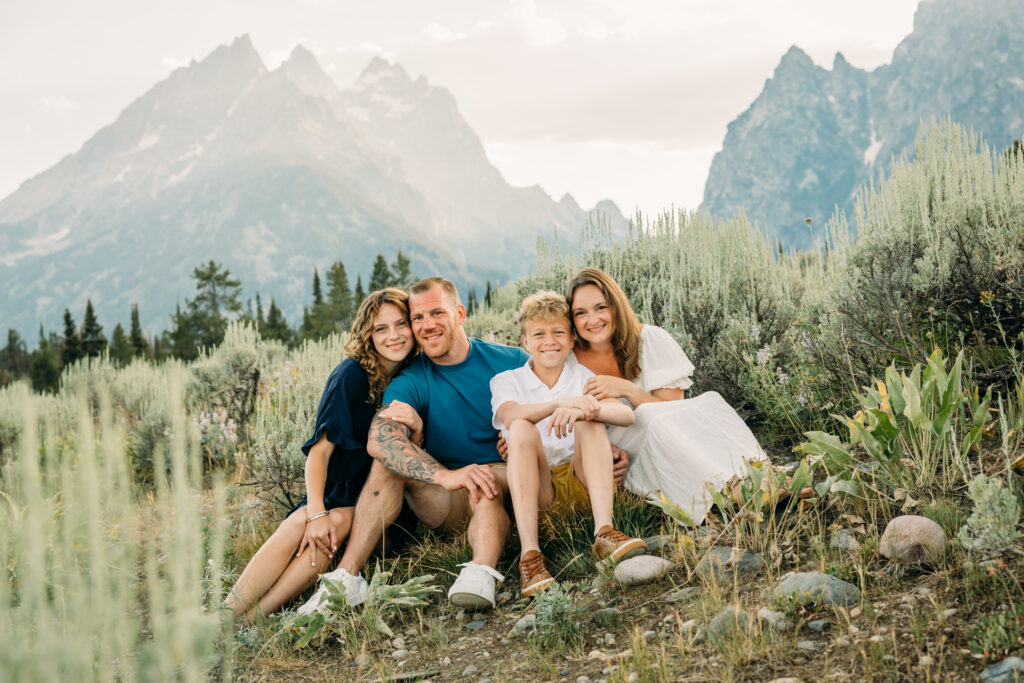 Kids running through grass during a Grand Teton family photography session