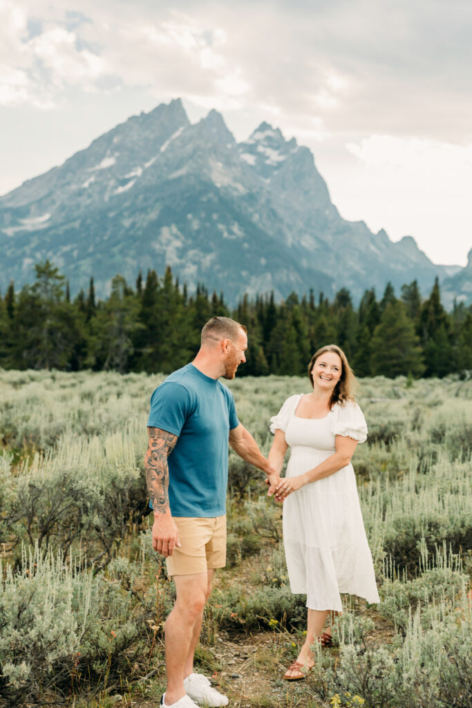 Kids running through grass during a Grand Teton family photography session