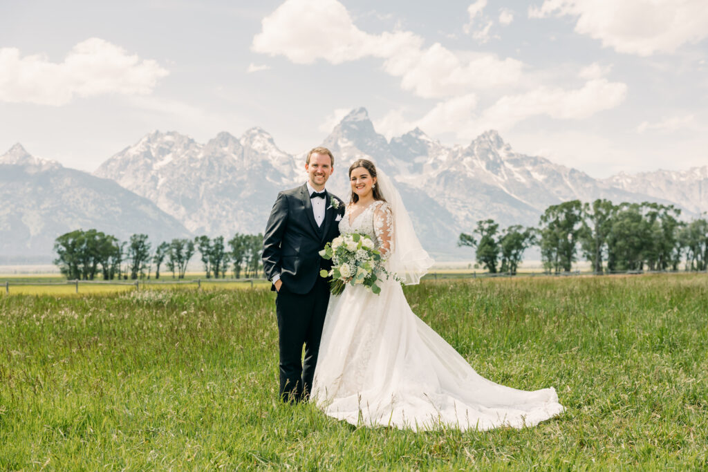 Mormon Row Grand Teton couple location inspiration for photography session couple in front of grasses and mountains