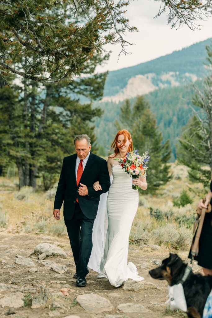 Eloping couple with the Teton mountain range in Grand Teton National Park