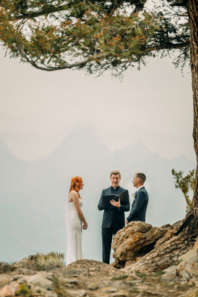 Adventure elopement photos with dramatic Teton mountains in Wyoming