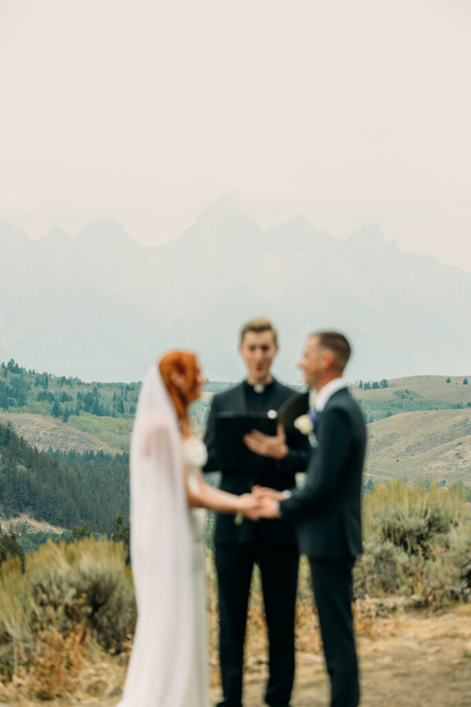 Adventure elopement photos with dramatic Teton mountains in Wyoming