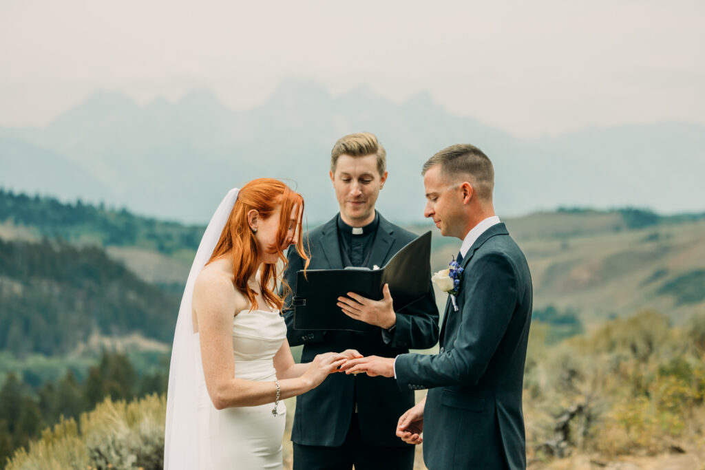 Adventure elopement photos with dramatic Teton mountains in Wyoming