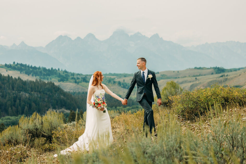 Adventure elopement photos with dramatic Teton mountains in Wyoming