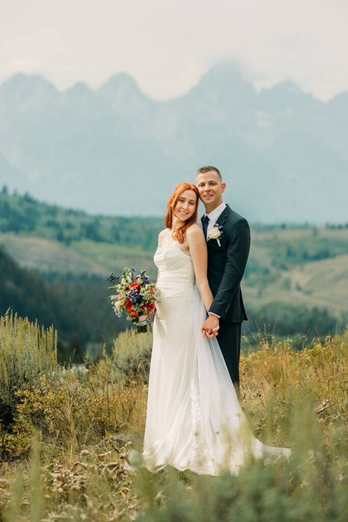 Adventure elopement photos with dramatic Teton mountains in Wyoming
