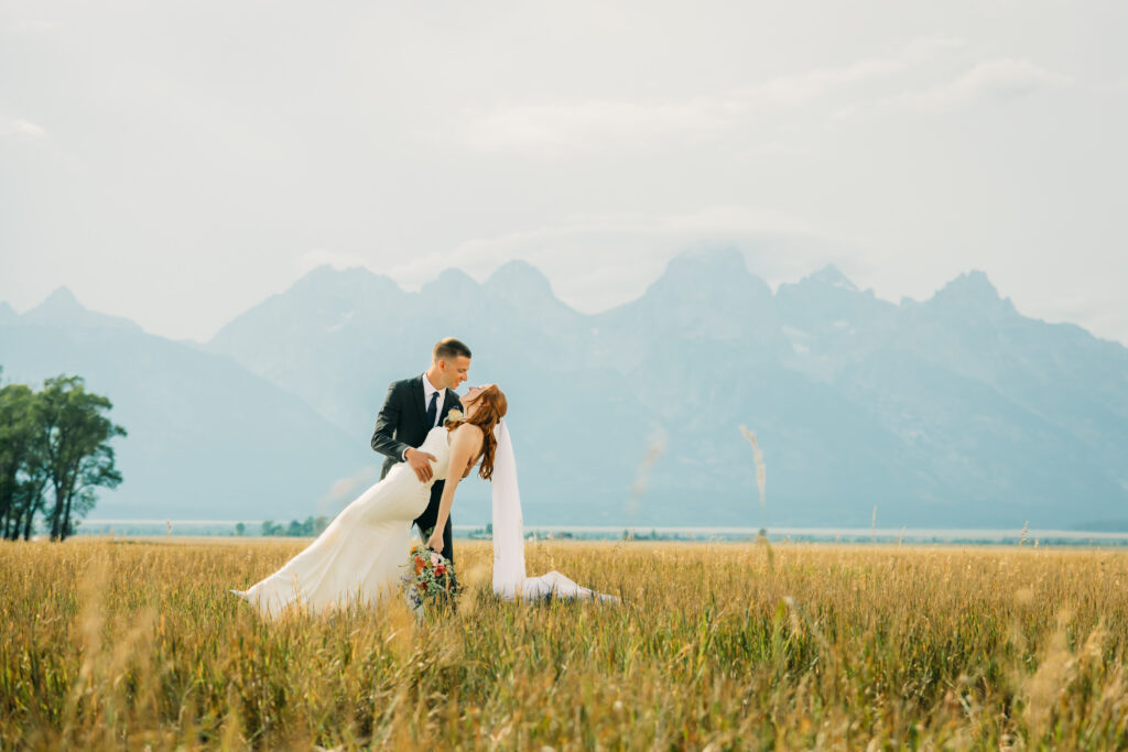 Bride and groom celebrating their Jackson Hole elopement with mountain views