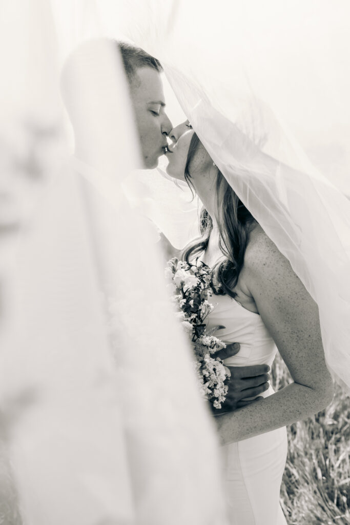 Bride and groom celebrating their Jackson Hole elopement with mountain views