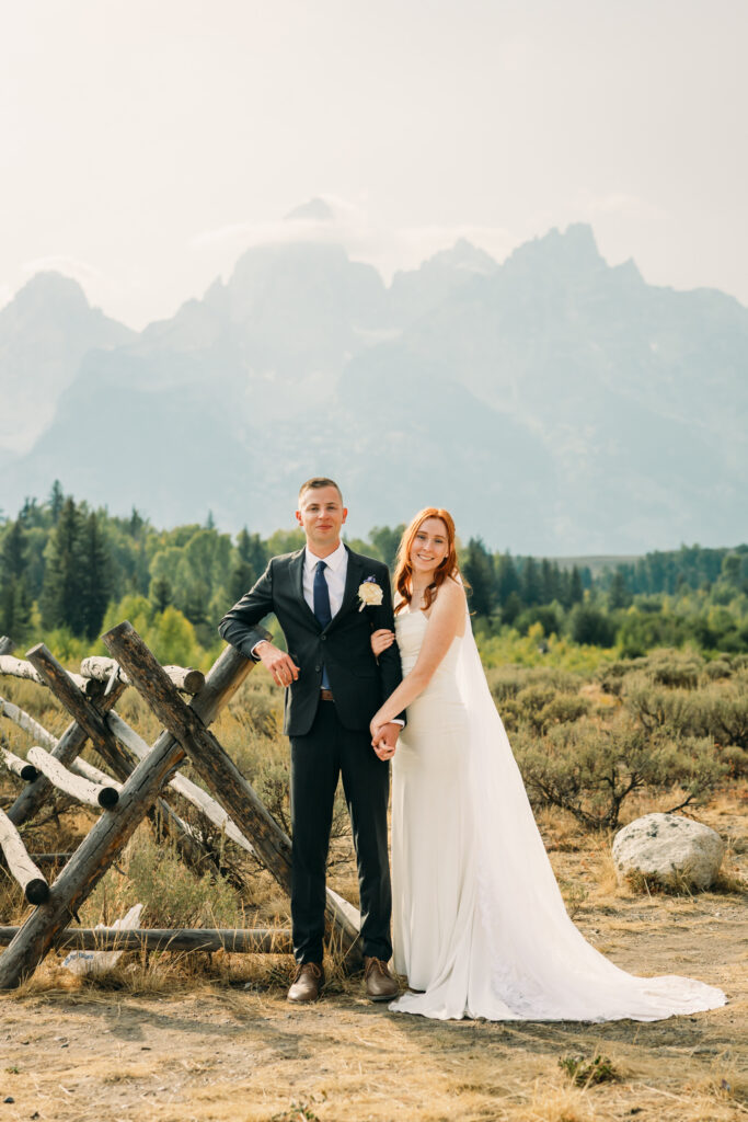 Eloping couple with the Teton mountain range in Grand Teton National Park
