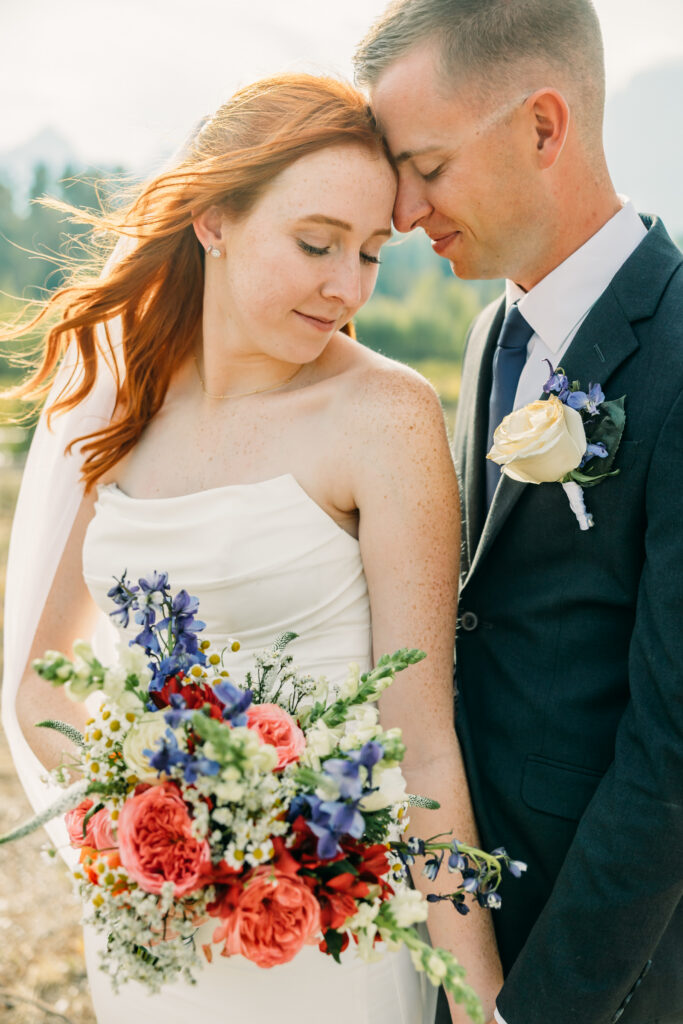 Eloping couple with the Teton mountain range in Grand Teton National Park
