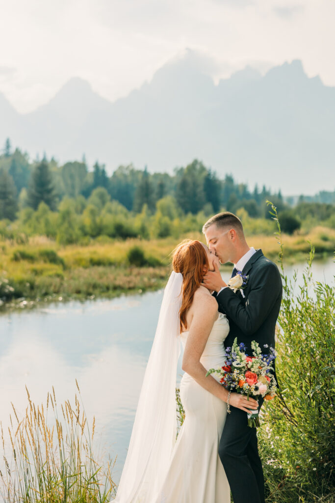 Eloping couple with the Teton mountain range in Grand Teton National Park