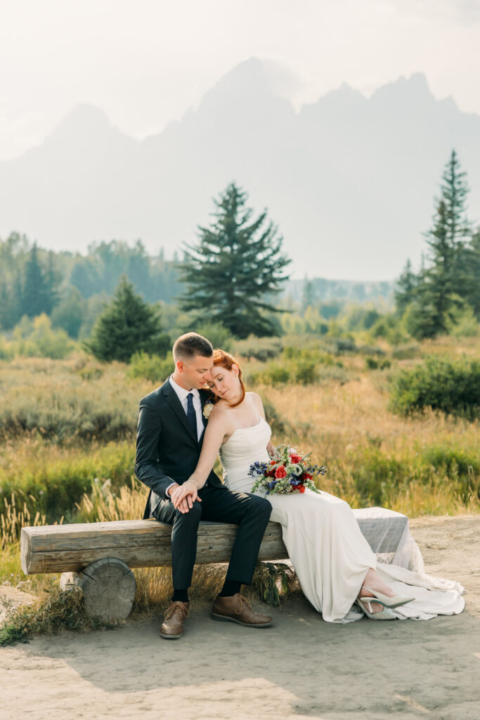 Eloping couple with the Teton mountain range in Grand Teton National Park