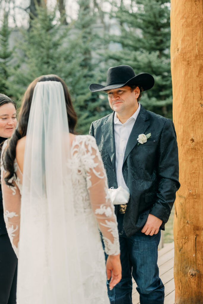 First kiss at Bentwood Inn Jackson Hole outdoor wedding ceremony