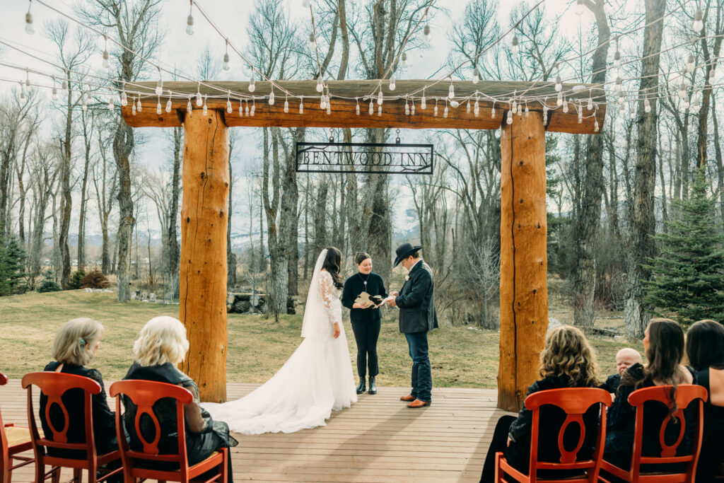 First kiss at Bentwood Inn Jackson Hole outdoor wedding ceremony