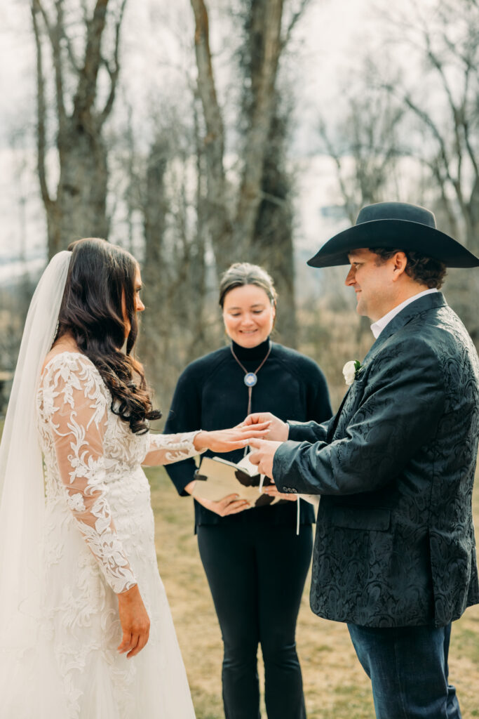 First kiss at Bentwood Inn Jackson Hole outdoor wedding ceremony