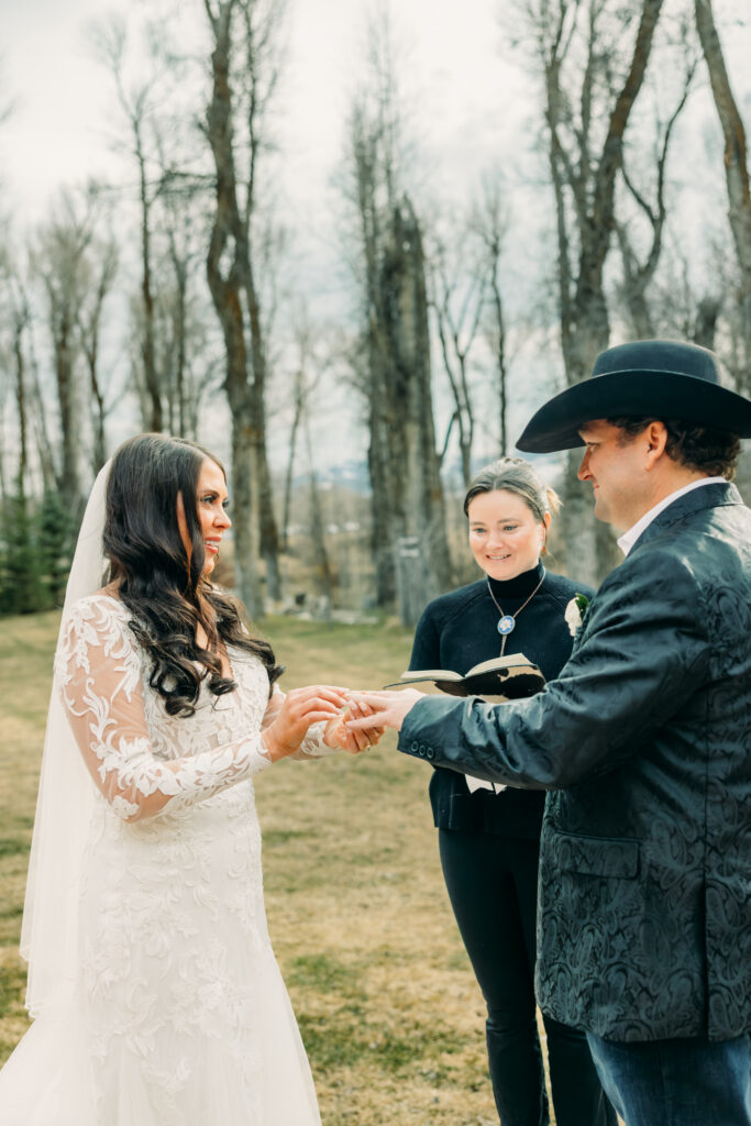 First kiss at Bentwood Inn Jackson Hole outdoor wedding ceremony